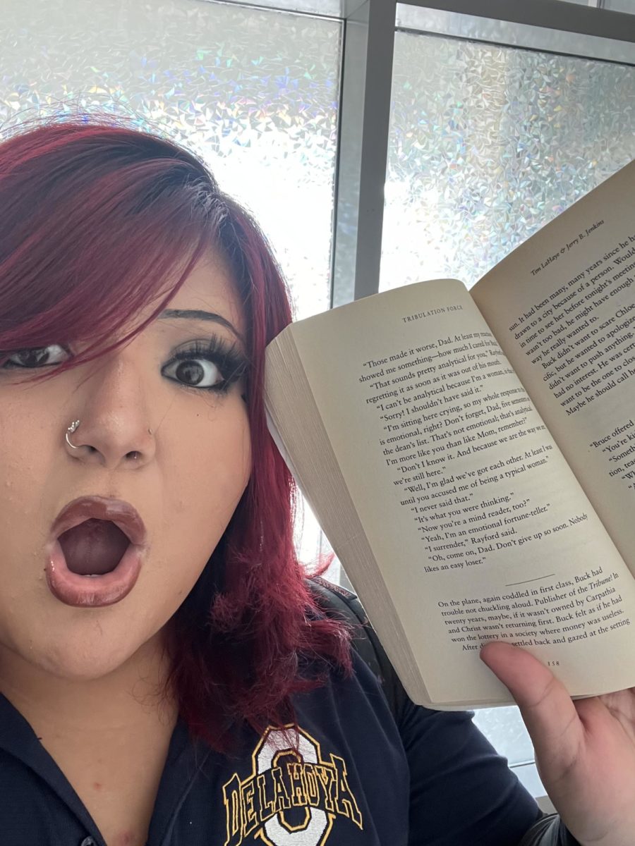 This is Alejandrina taking a selfie and showing off one of her favorite books.